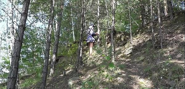  Under a skirt without panties. Hairy pussy and big ass in a short dress climbs mountains in nature.